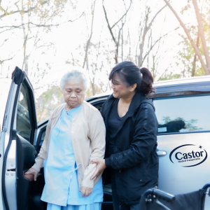 Elderly assisted by young woman