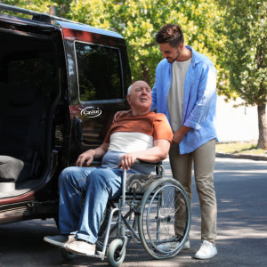 Young man assisting senior man