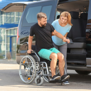 Young woman helping man to ride