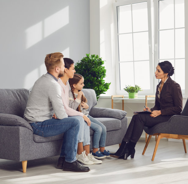 couple consulting with their kid