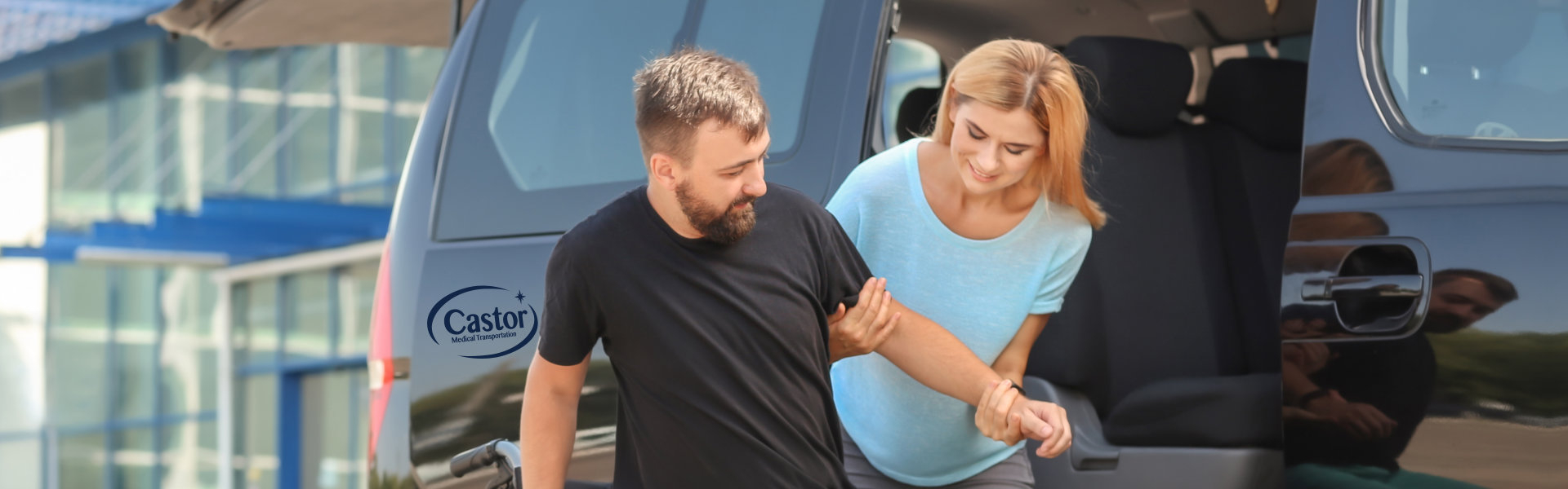 Young woman helping man to get into the van