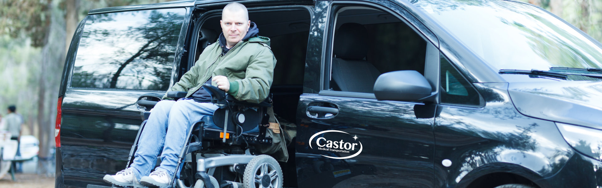 man in a wheelchair ramp of van