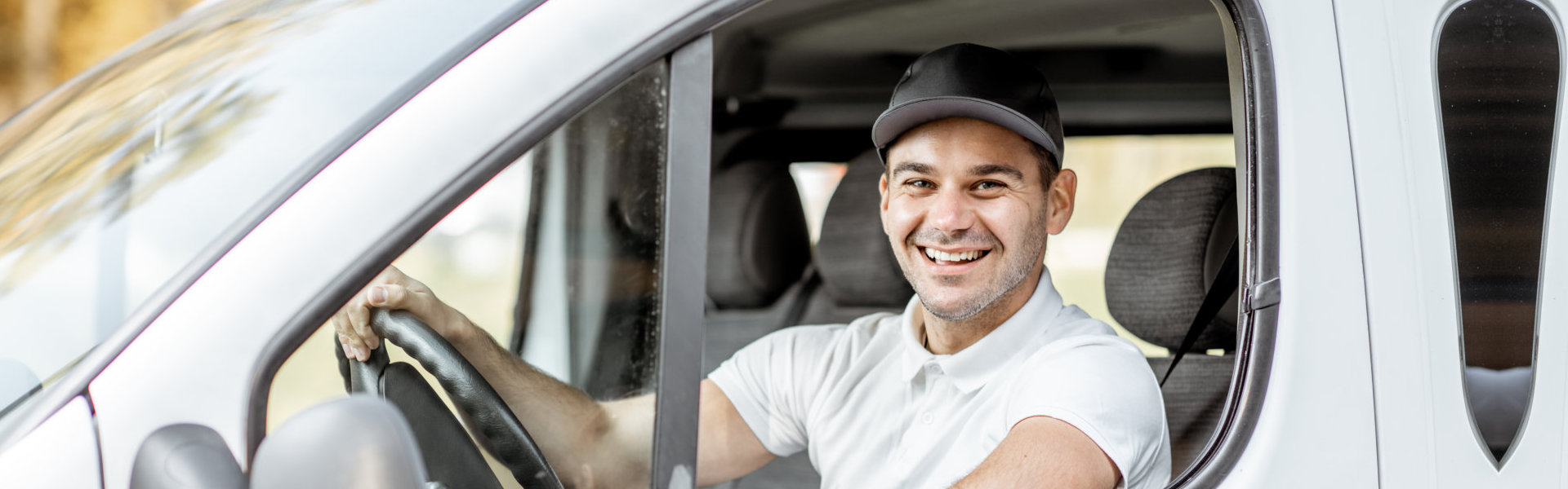 Young male driver smiling